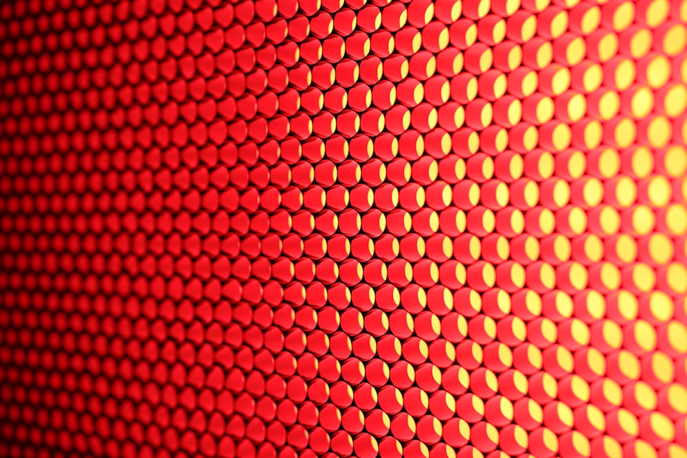a close up of a red and yellow background