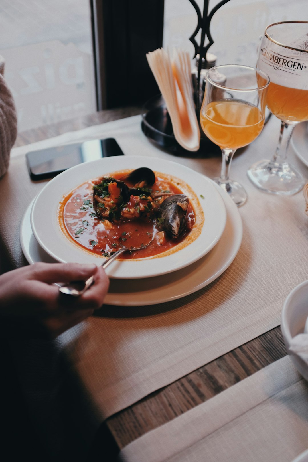 person scooping strew from plate