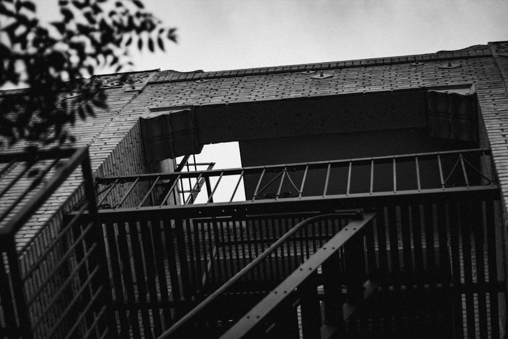 grayscale photography of building and stairs