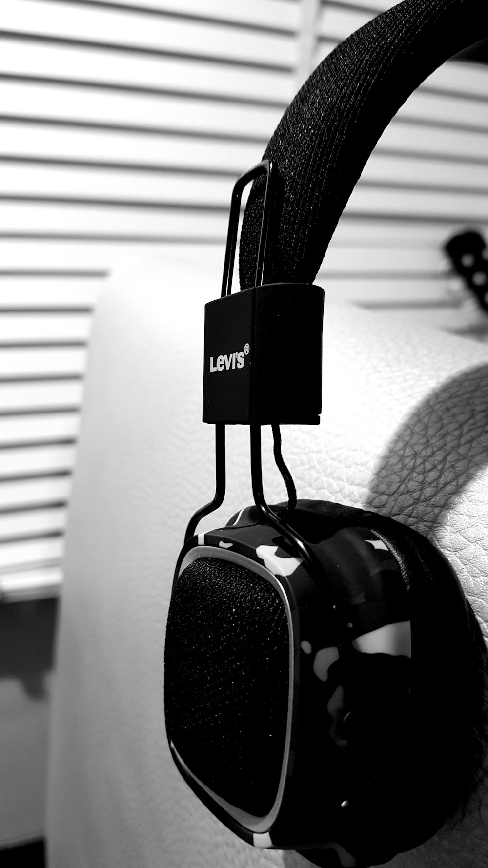 black headphones on gray sofa