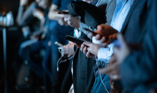 people using phone while standing