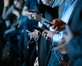 people using phone while standing