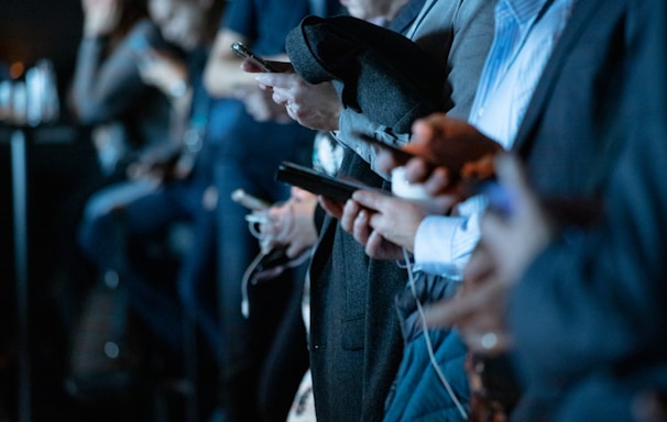 people using phone while standing