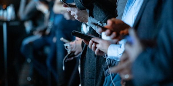 people using phone while standing