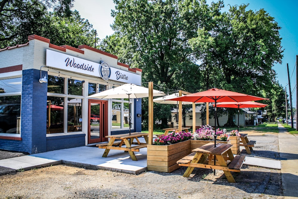 Woodside store surrounded with tall and green trees during daytime