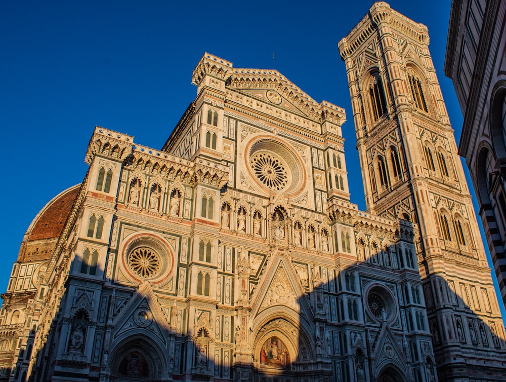 low-angle photography of brown concrete cathedral during daytime