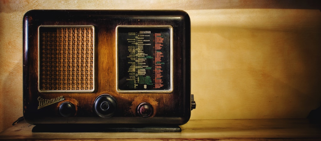 selective focus photography of brown transistor radio