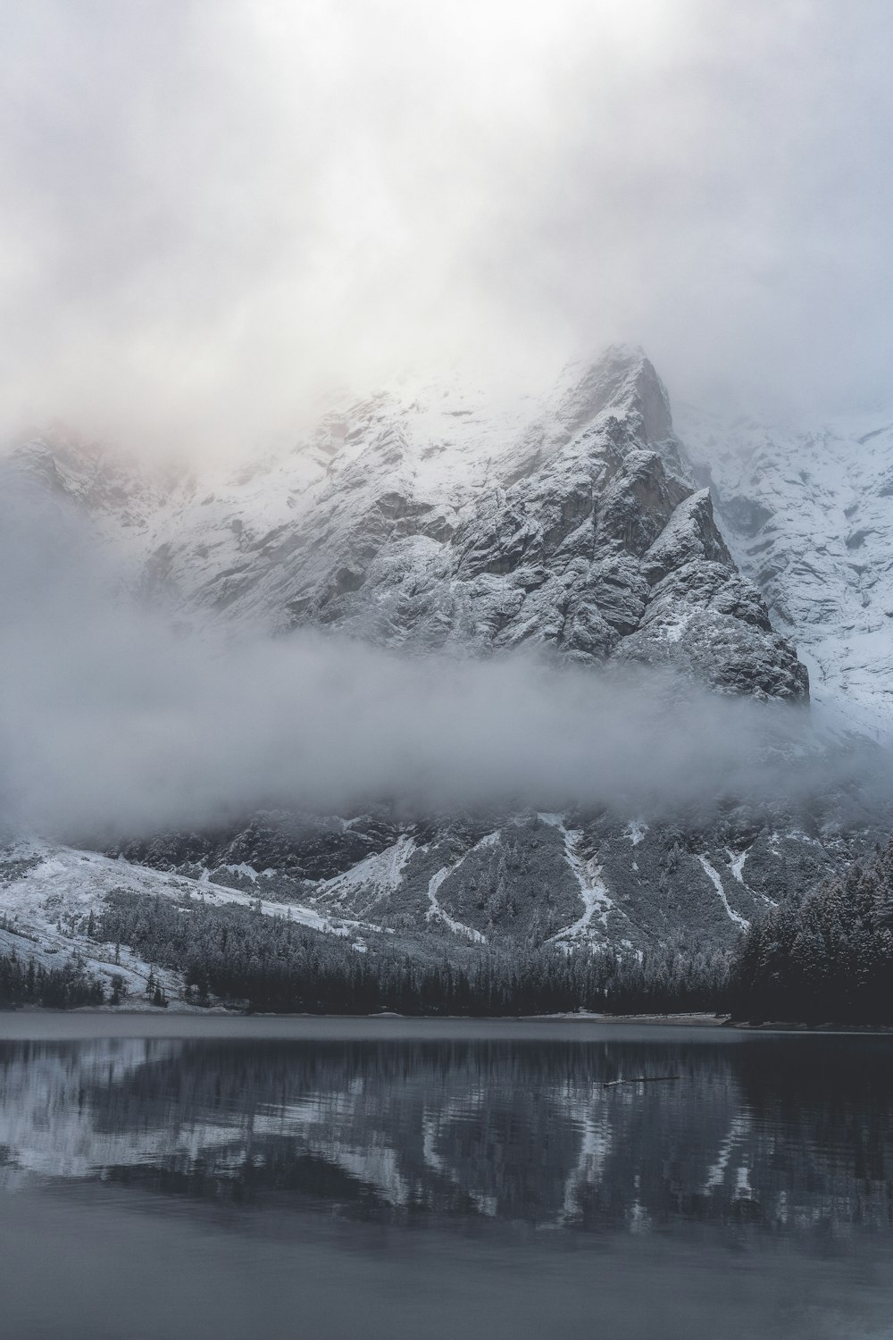 reflection of mountain on body of water