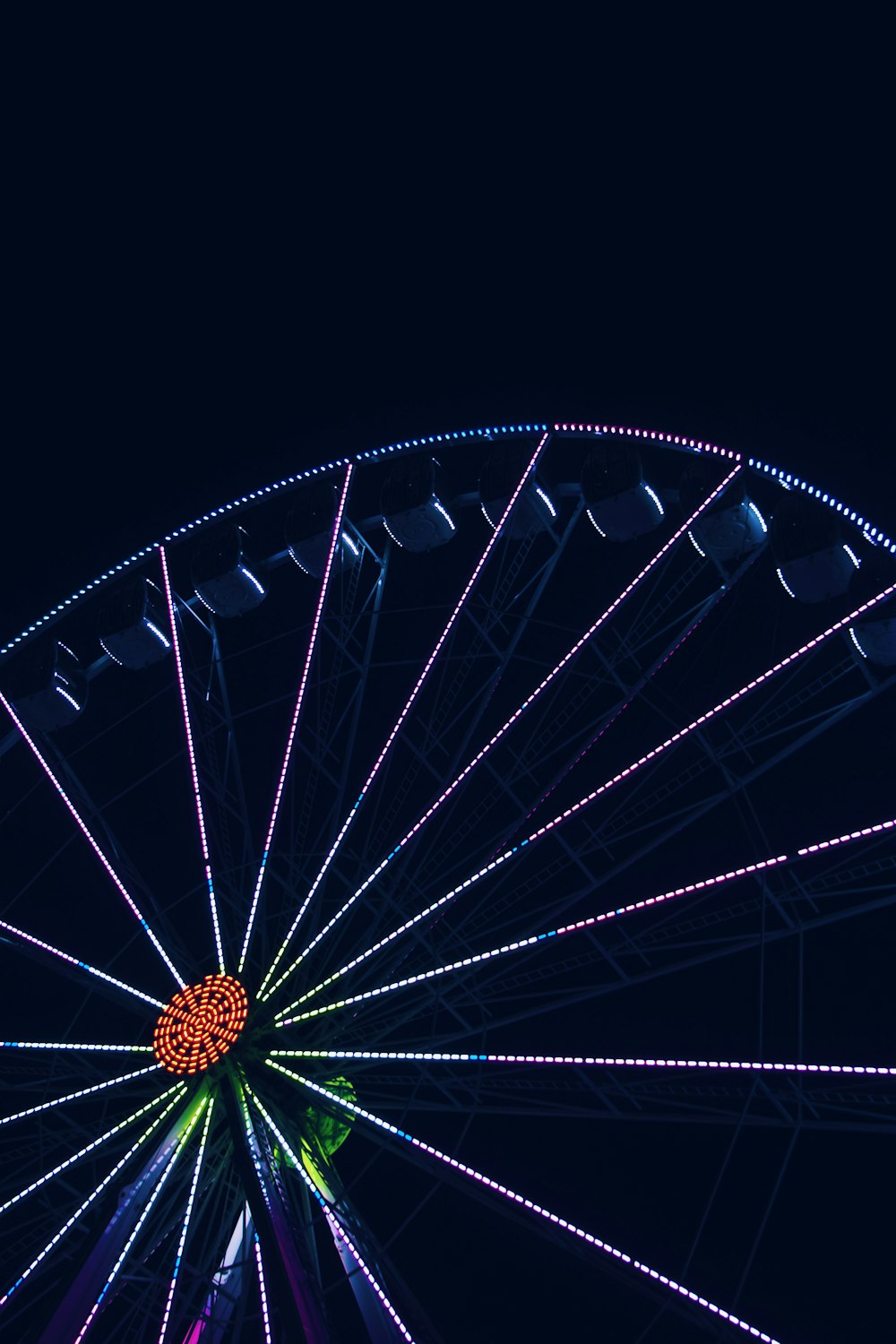 low-angle photography of Ferris wheel at night