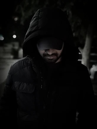 man wearing black hoodie
