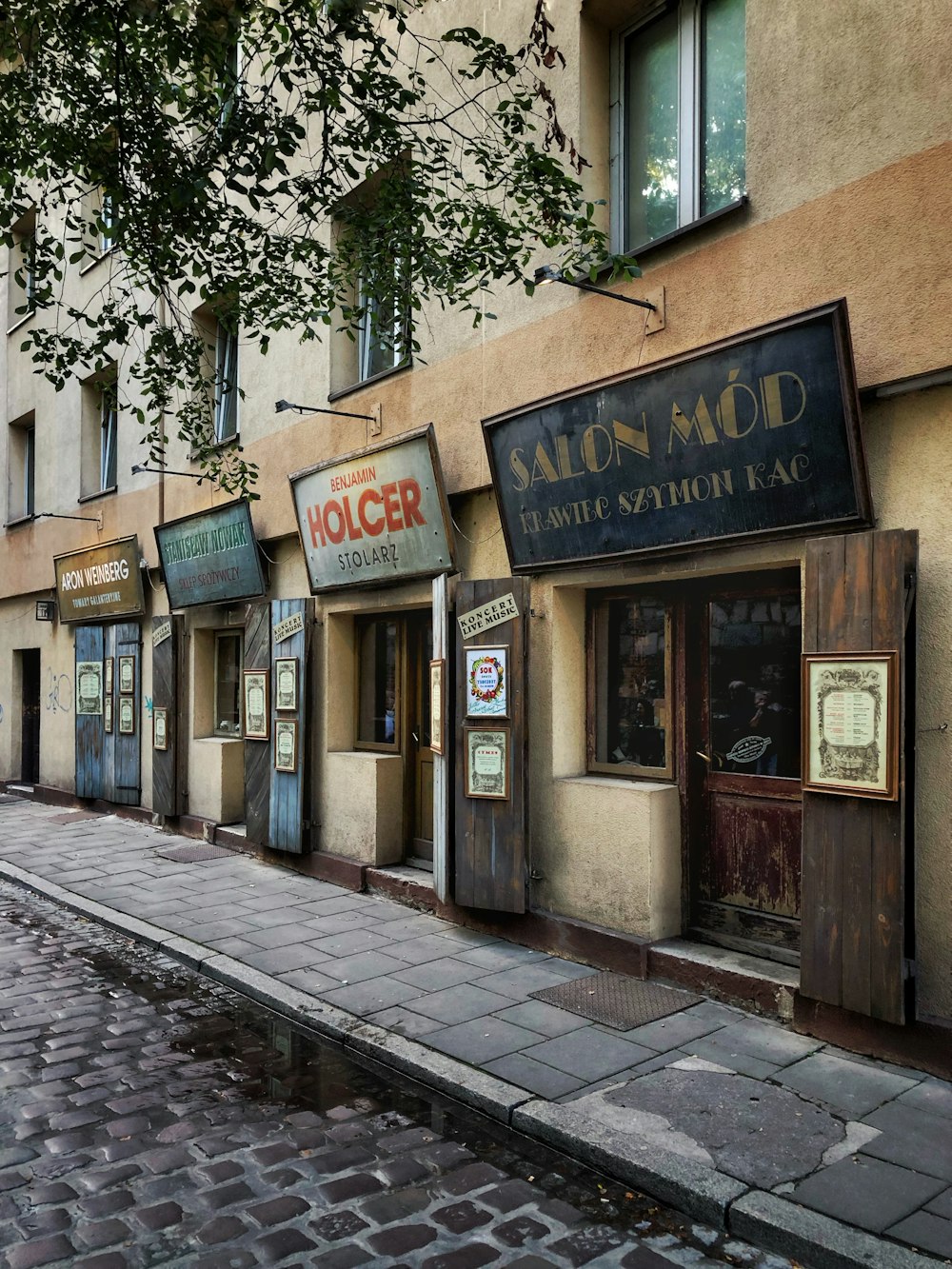 concrete sideways beside store facades