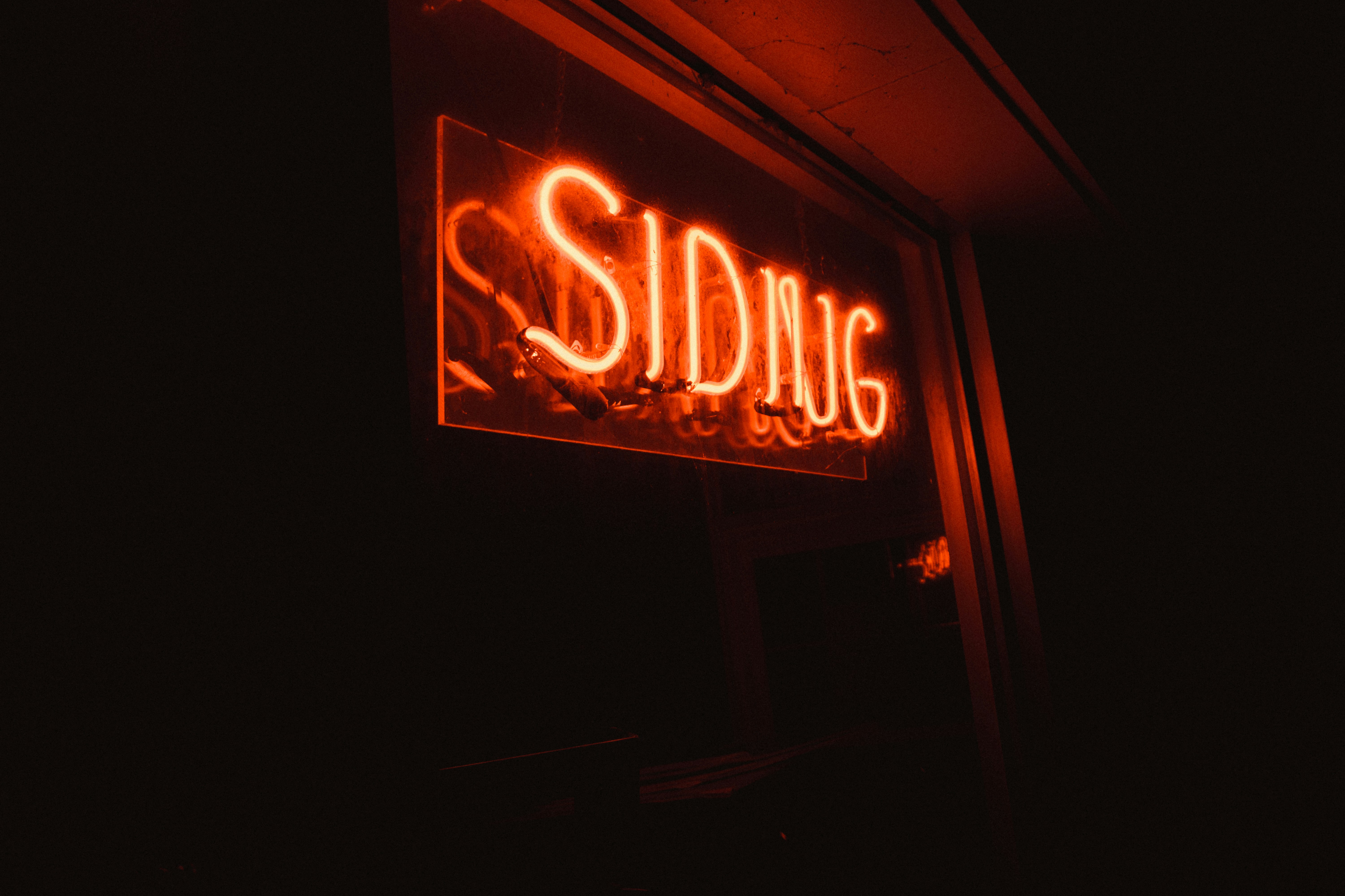SIDIIJG neon light signage on wall