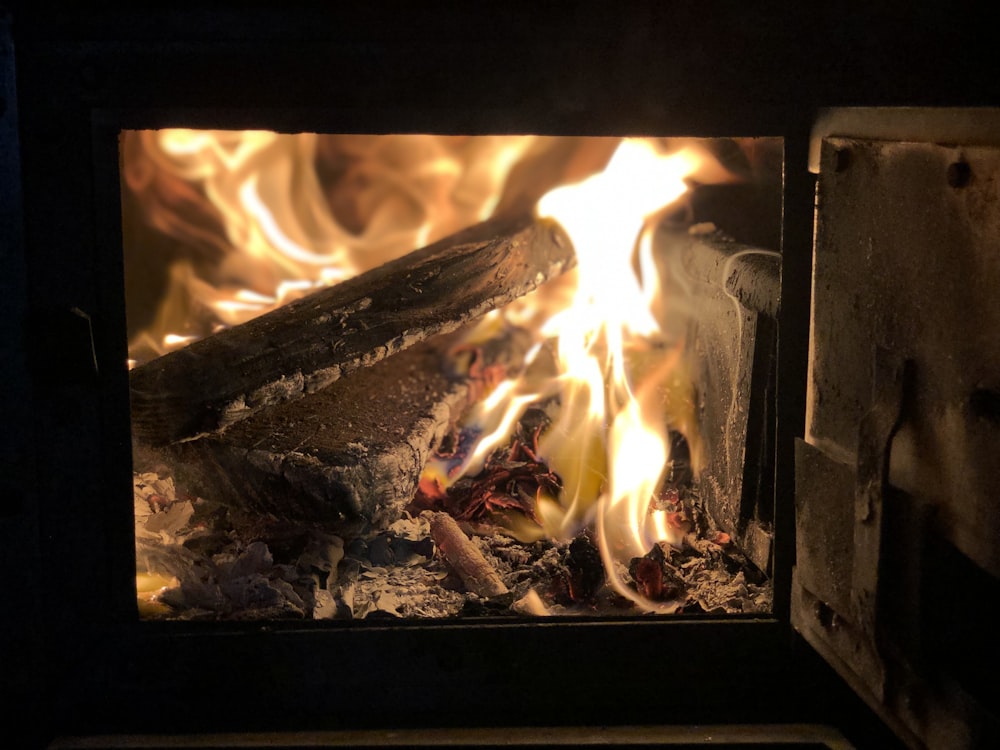 burning firewood in wood burner