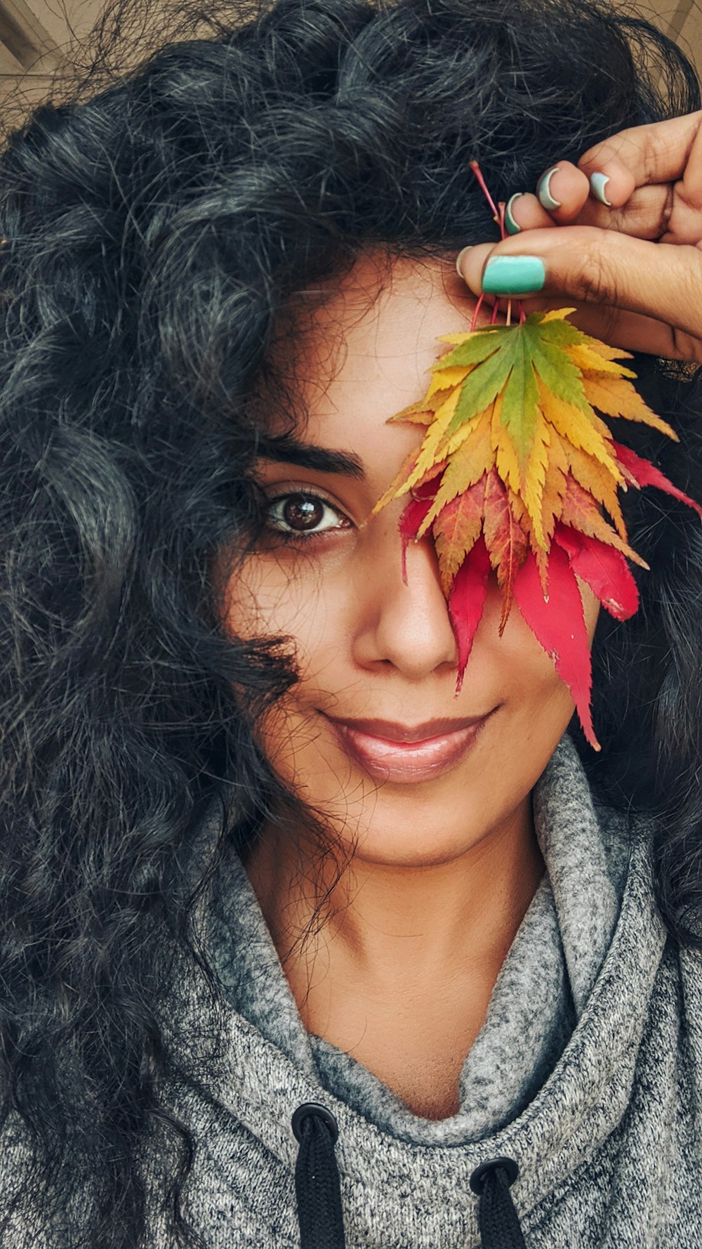 woman holding withered leaves