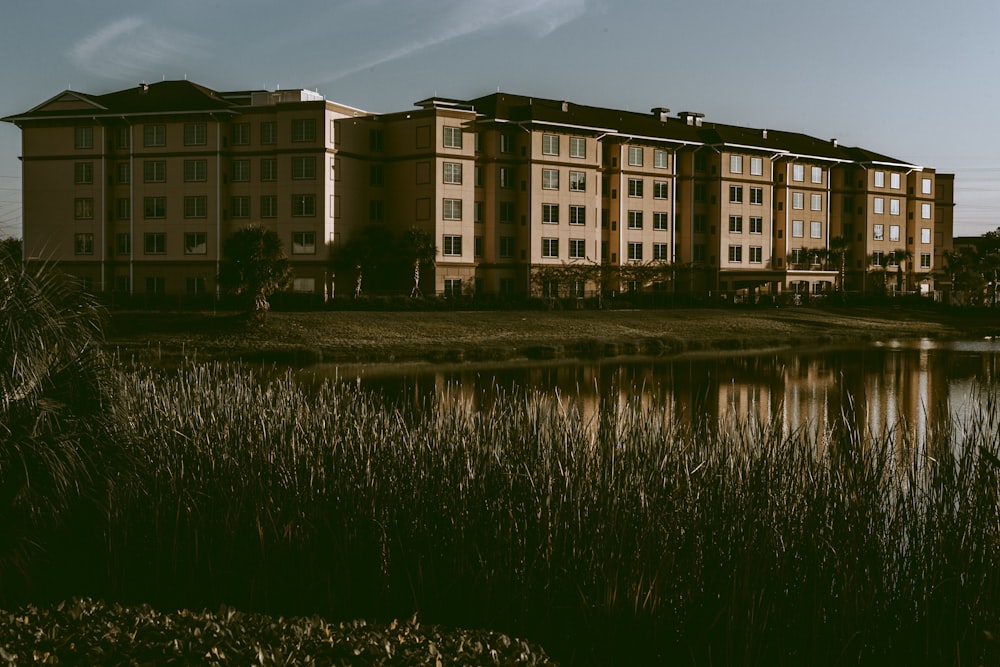 brown concrete structure beside body of water