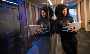 woman in black shirt using laptop computer