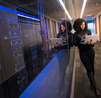 woman in black top using Surface laptop