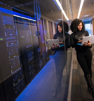 woman in black top using Surface laptop