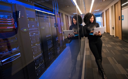 woman in black top using Surface laptop