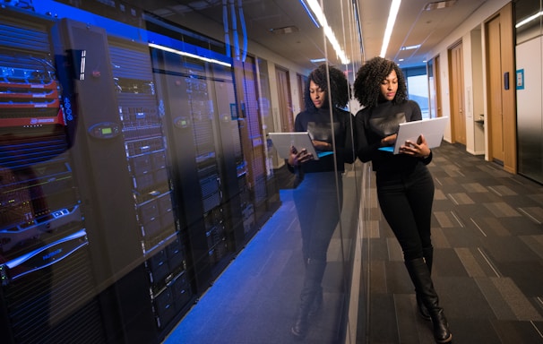 woman in black top using Surface laptop