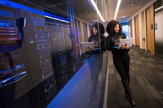 woman in black top using Surface laptop