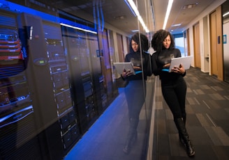 woman in black top using Surface laptop