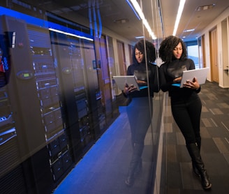 woman in black top using Surface laptop