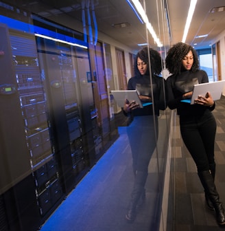 woman in black top using Surface laptop