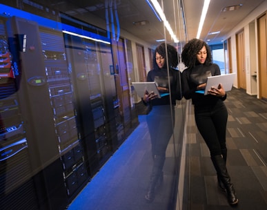 woman in black top using Surface laptop