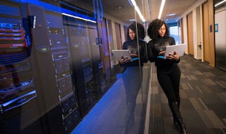 woman in black top using Surface laptop