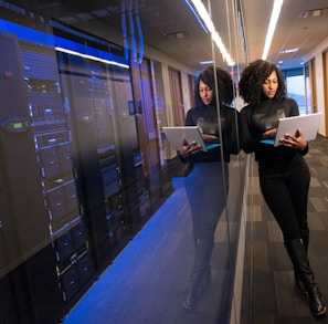 woman in black top using Surface laptop