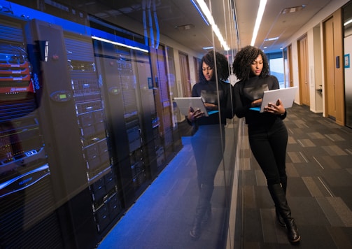 woman in black top using Surface laptop