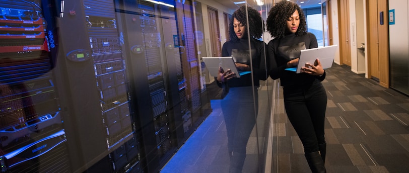 woman in black top using Surface laptop