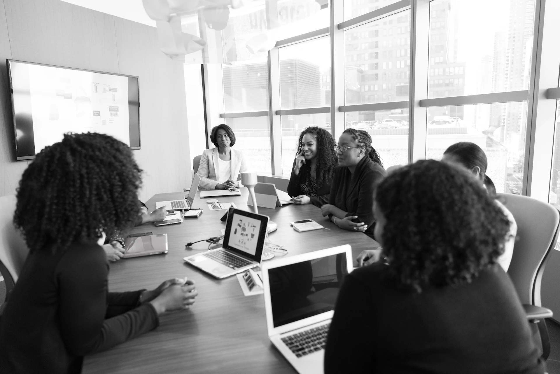 African colleagues meeting beside a window