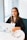 woman in black blazer using MacBook