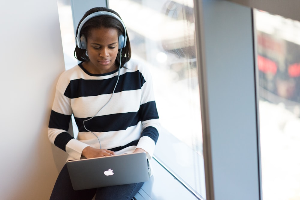 woman using MacBook Pro