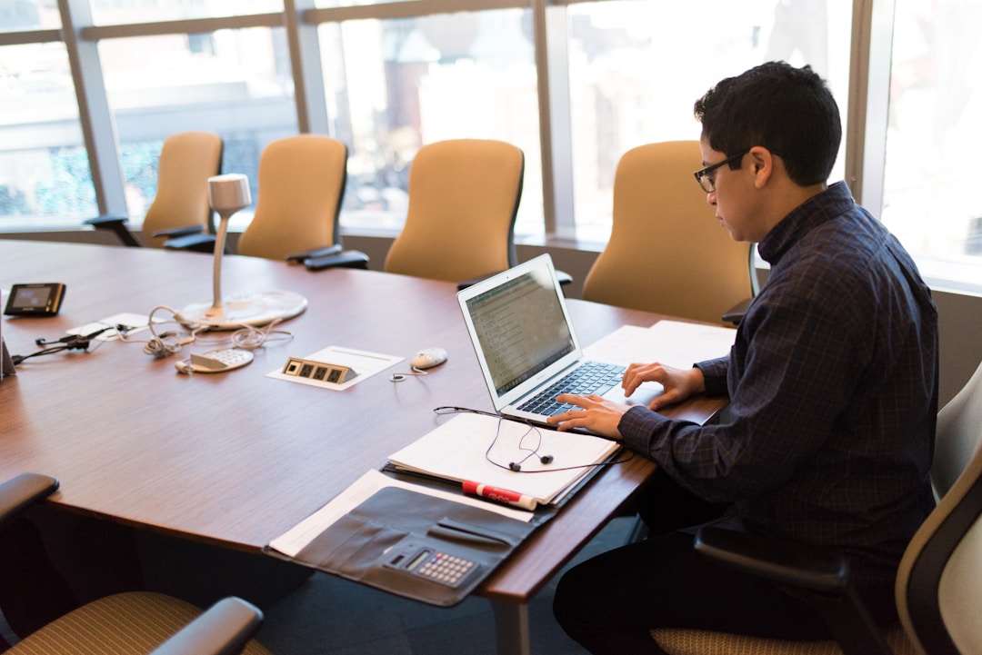 A male professional working on mitigating human error and increasing accuracy using proposal response software