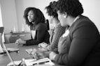 two women looking at talking woman