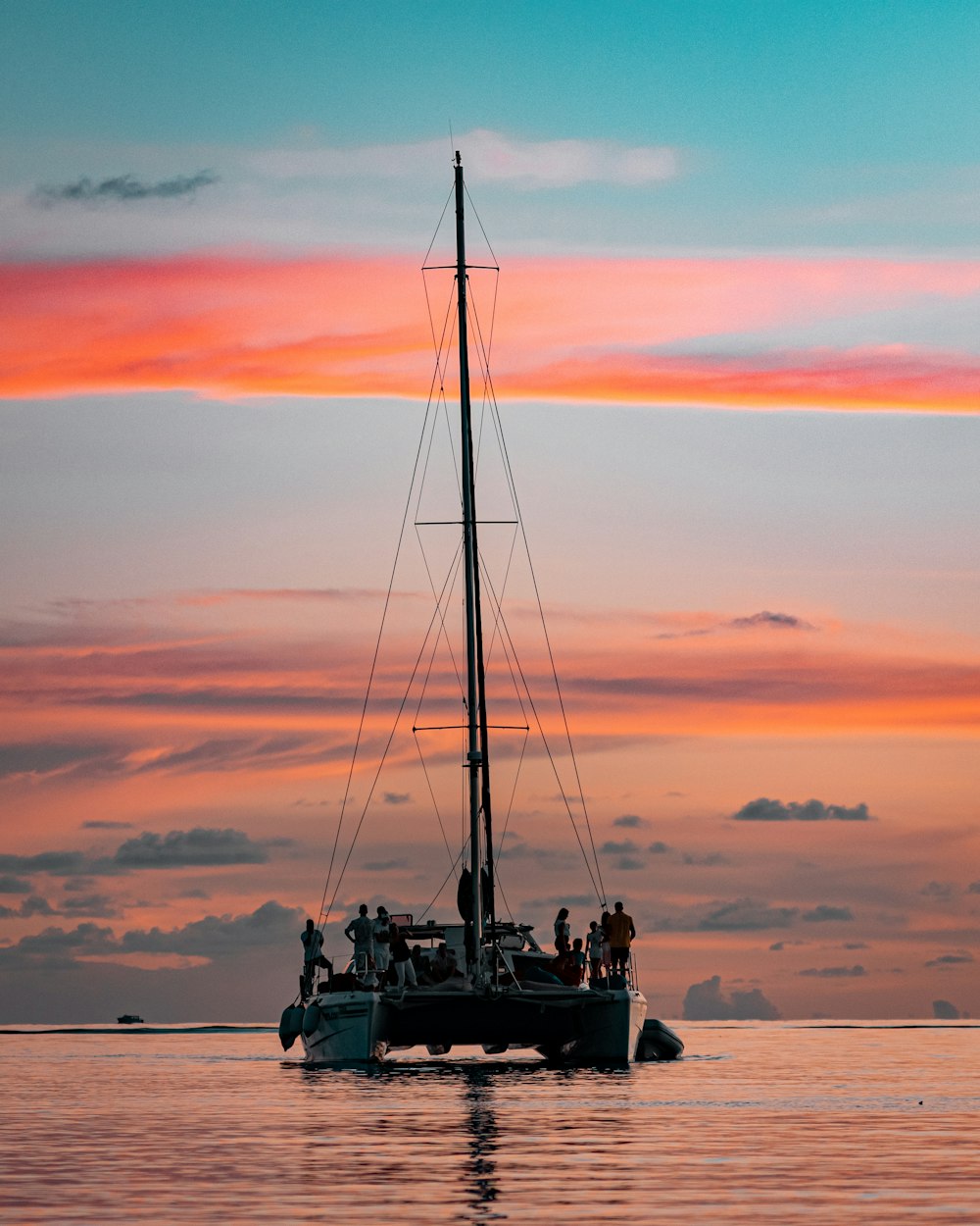 gray and white boat on body of water during daytime