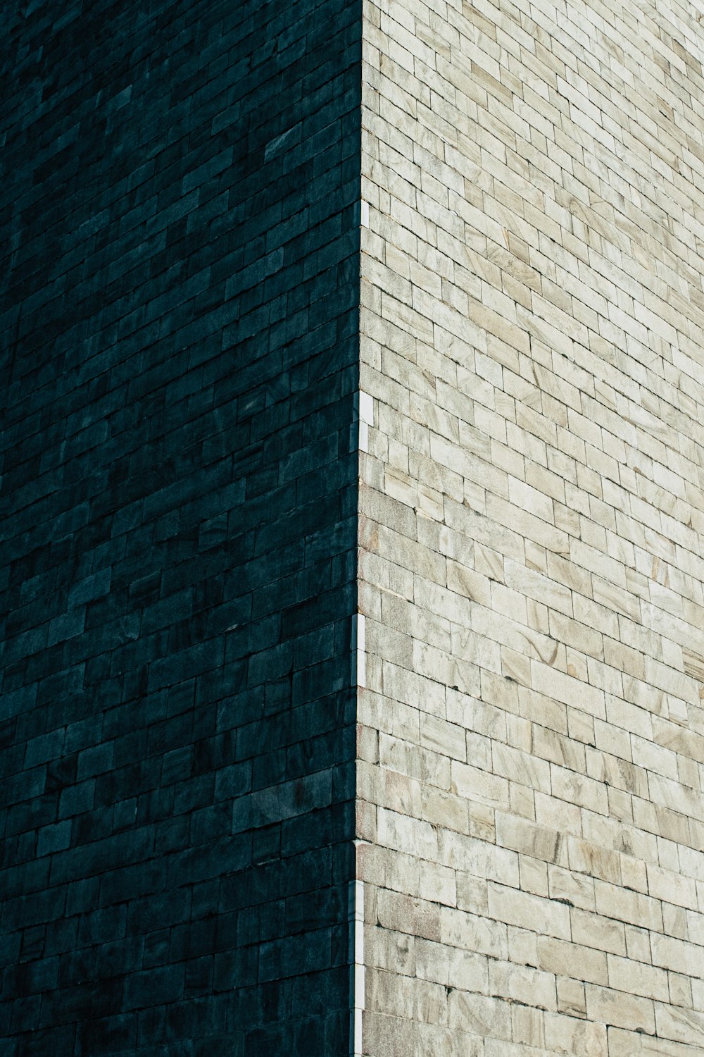 a clock on the side of a brick building