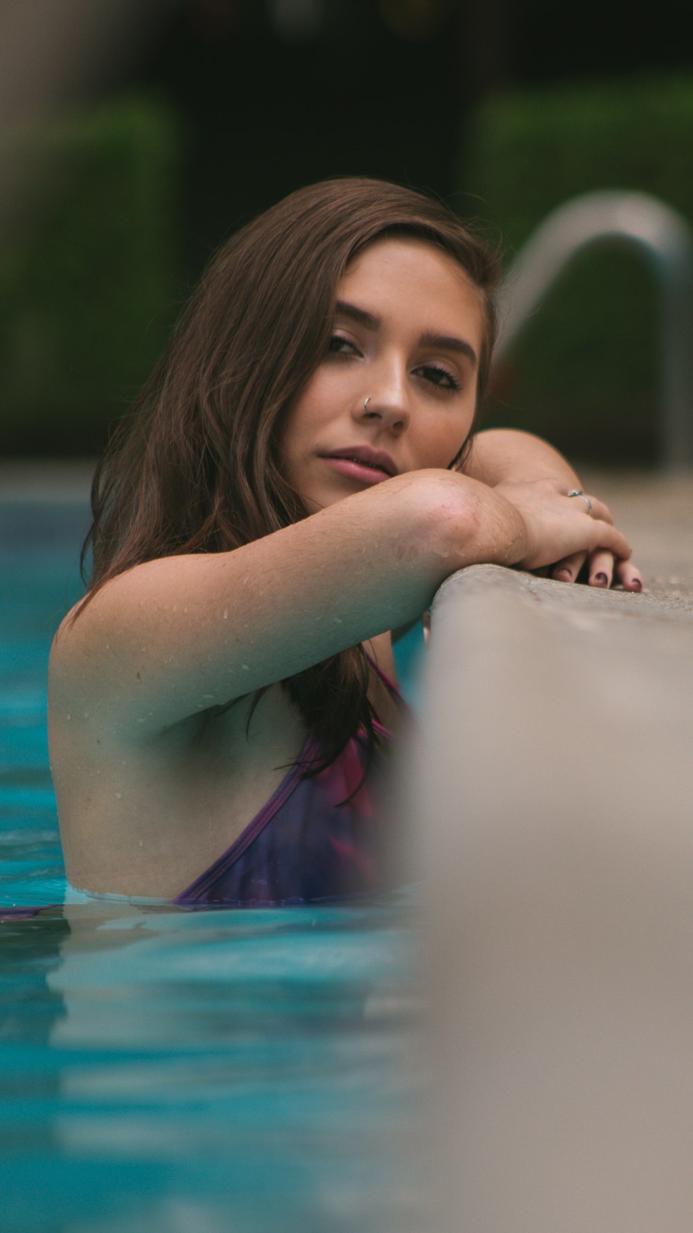 woman on the edge of swimming pool