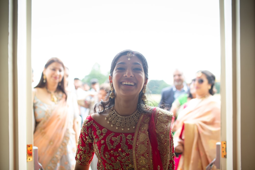 woman in pink and gold floral traditional dress