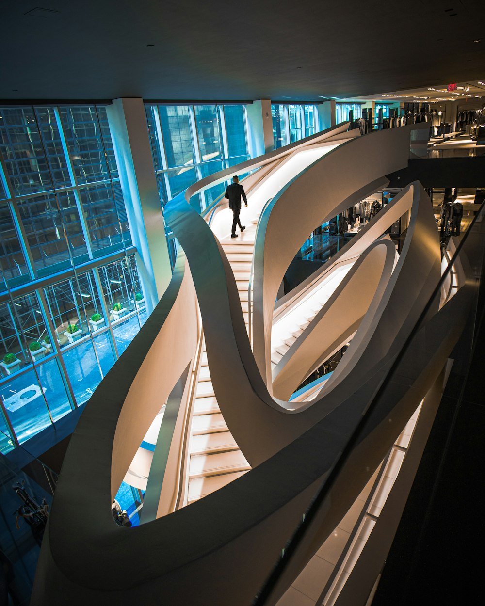 person walking up the stairs inside building