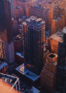 Visualization of airflow patterns around urban buildings under sunset lighting.