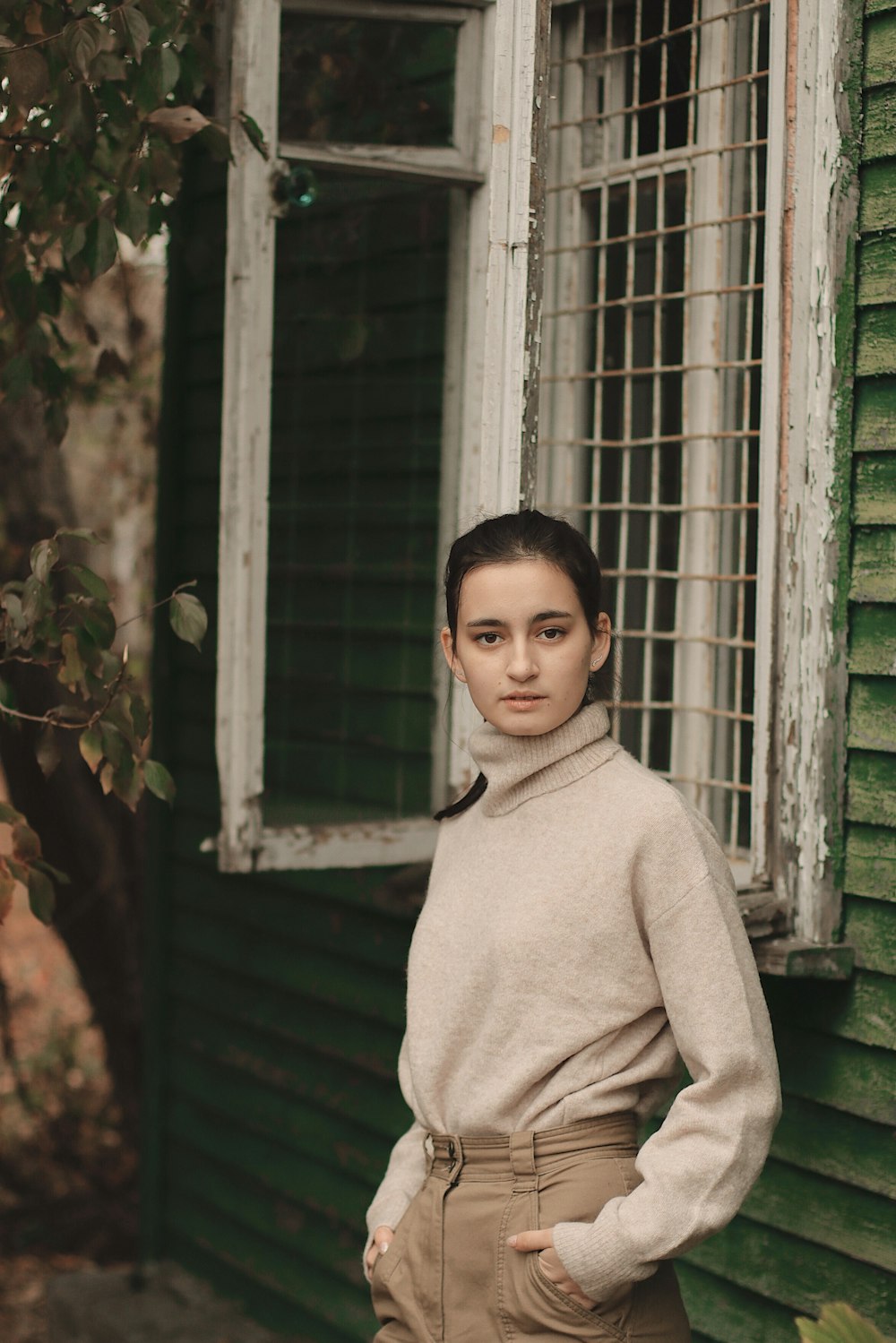 woman leaning on window