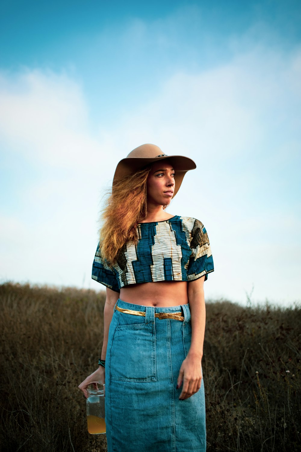 woman standing on grass field during daytime