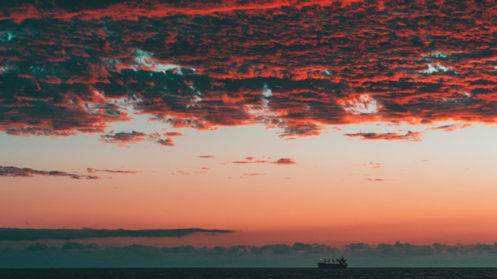 cargo ship sailing during golden hour