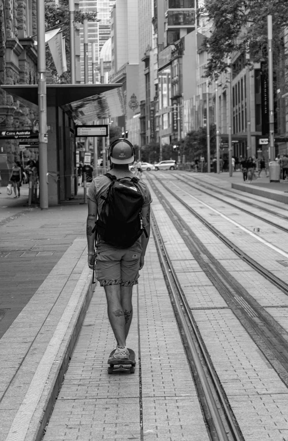 man walking near posts