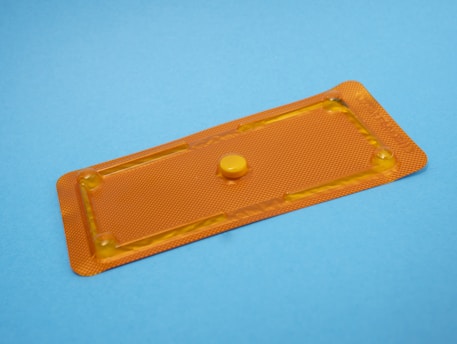 round orange medication pill
