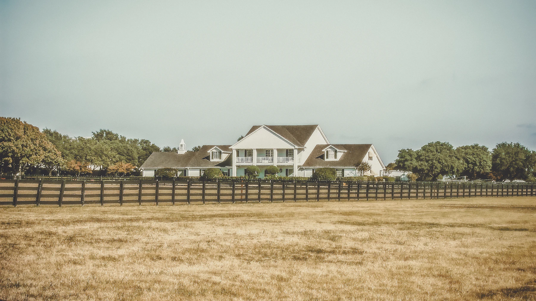 White two-story home in a Central Texas neighborhood